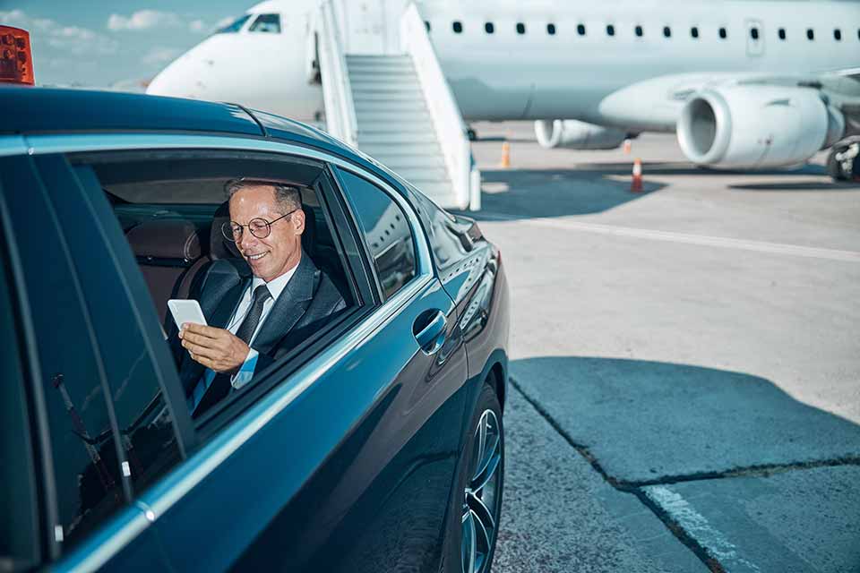 Image shows a business mand in a limousine. Meet and greet with Copenhagen Luggage Service takes care of luggage hassle so you can get the most out of your stay in Copenhagen